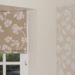 Photo of roman blind and matching wallpaper in a floral design.