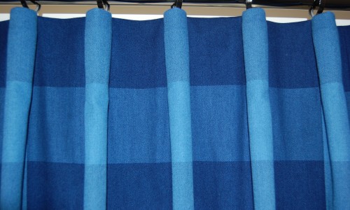 Photo showing a close up of a hand sewn curtain with cartridge pleat